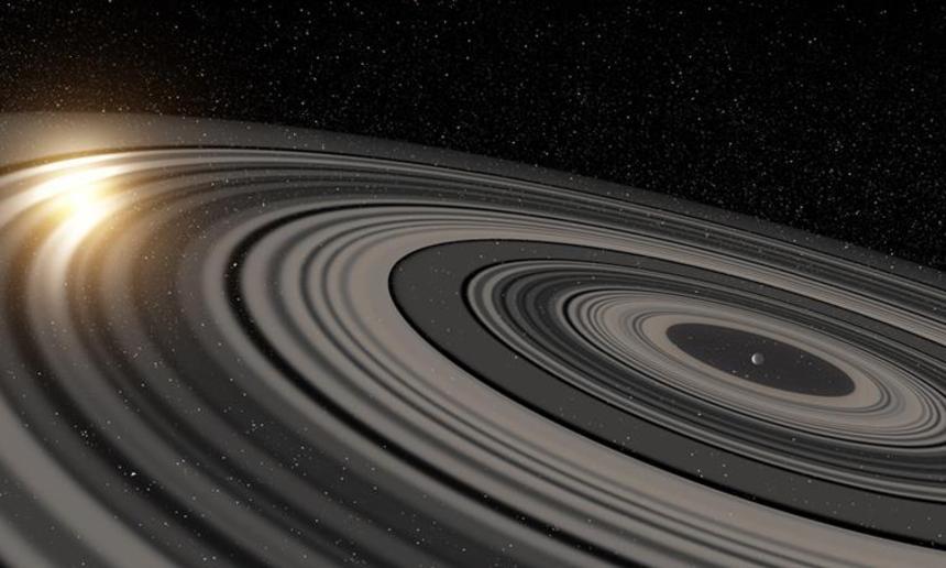 토성에 비해 600배 이상 더 거대한 고리를 갖고 있는 외계행성 J1407b를 표현한 그림. 이미지=ESA